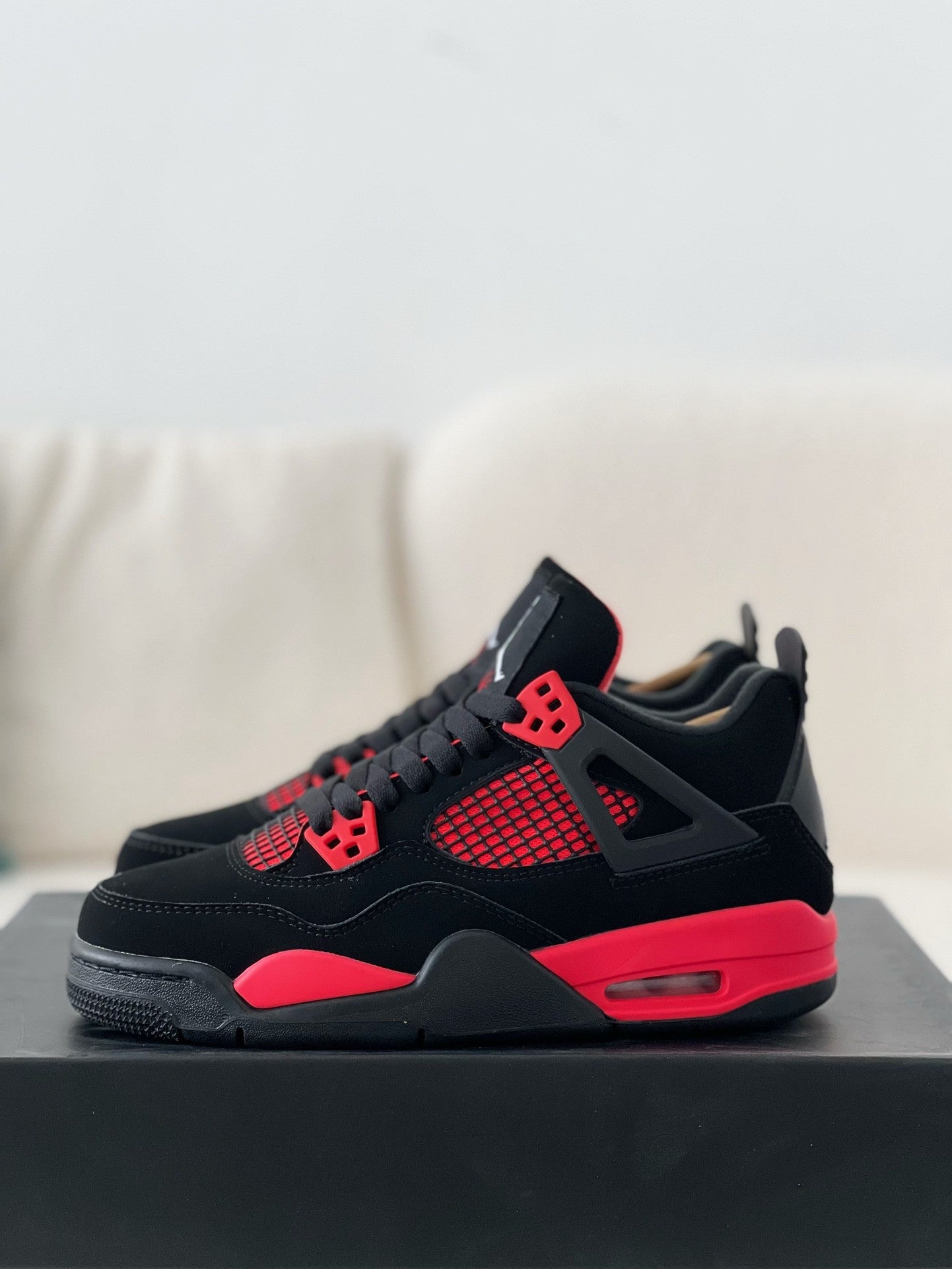 Red jordan iv on sale