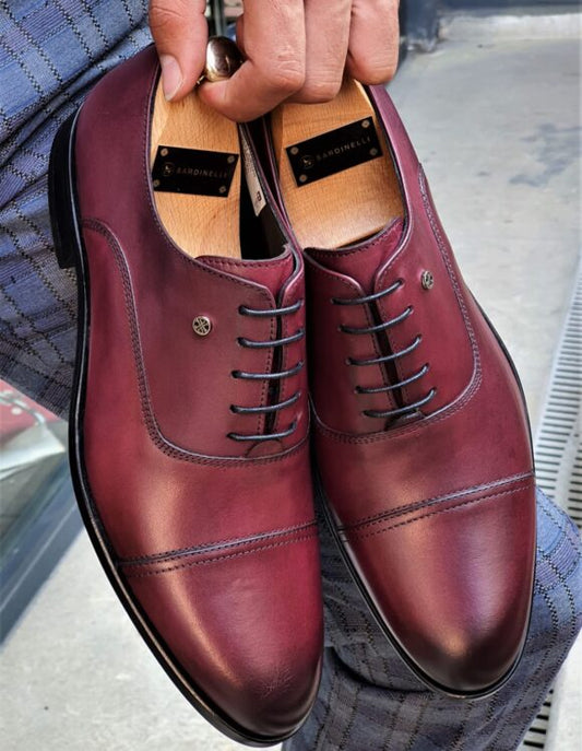 Top view of Bordeaux Crest Oxfords with premium burgundy leather and stitched cap-toe design.