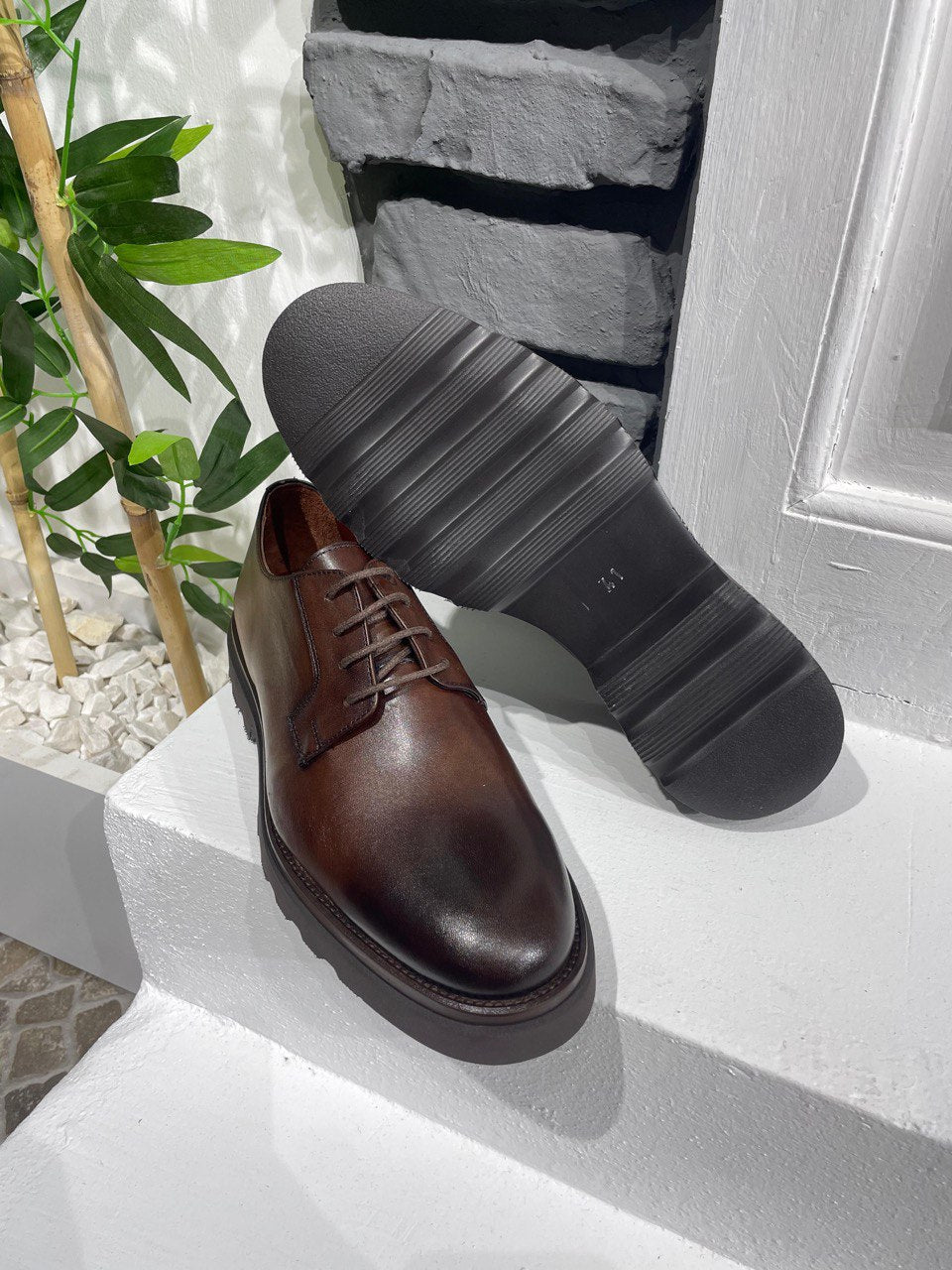 Classic Brown Leather Men's Derby Shoe – underside view, showing the chunky black sole and durable construction, ideal for versatile wear.