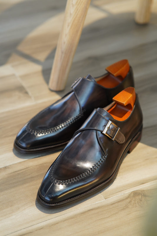Handcrafted Dark Brown Single Monk Strap Shoes – pair with shoe trees on a wooden floor, emphasizing premium full-grain leather and elegant single buckle closure.