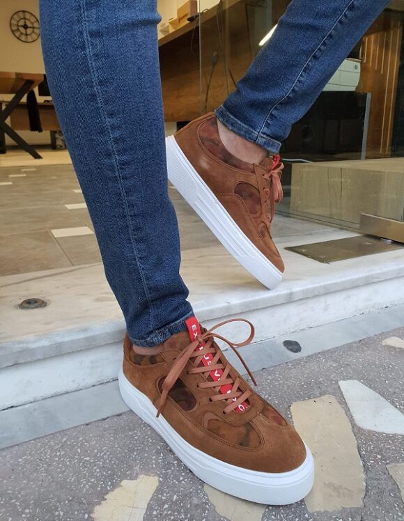 Handcrafted Brown Suede Sneakers – worn by a man in dark denim jeans, showcasing a modern mid-top design and a thick white sole.