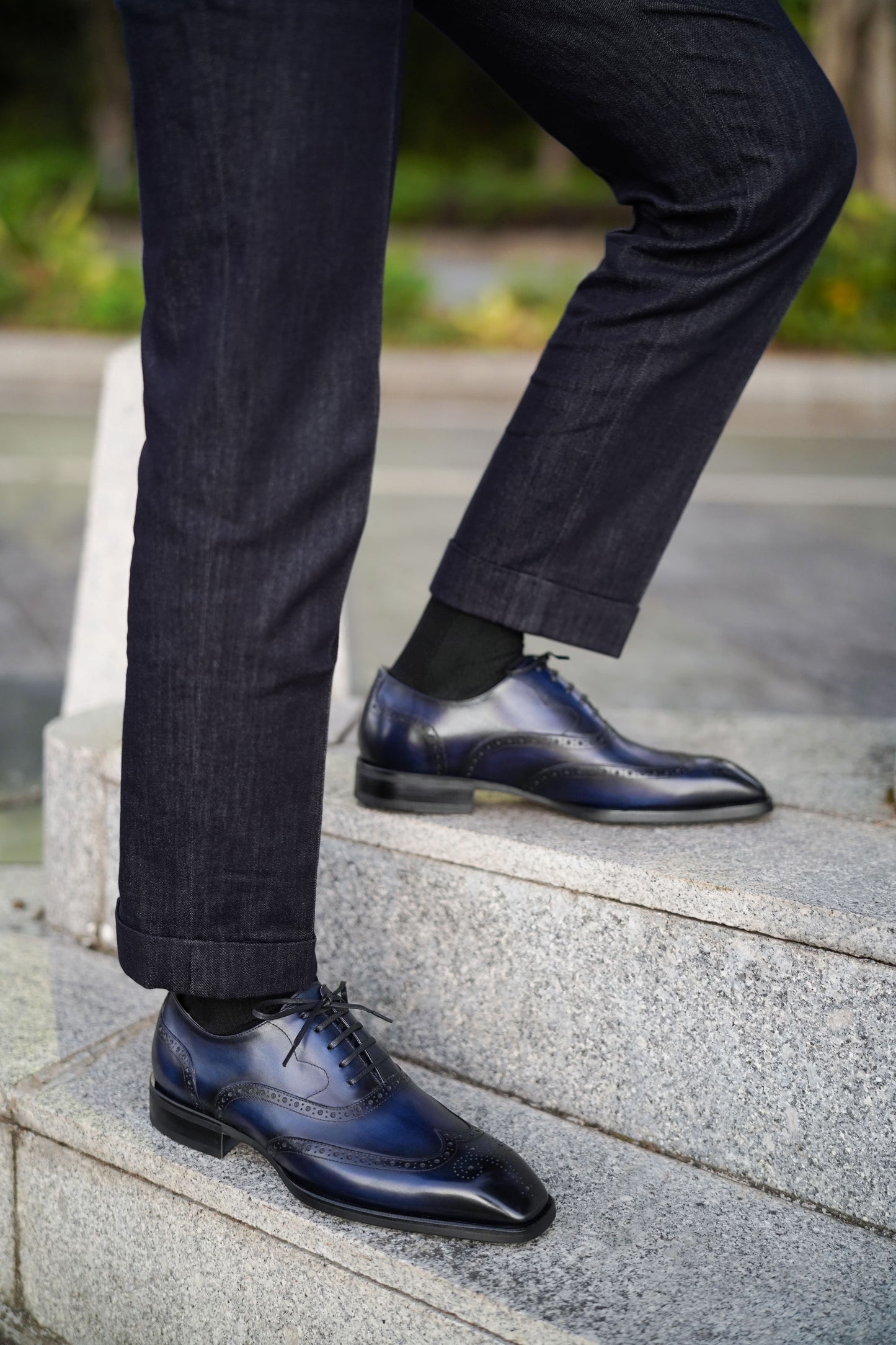 Men’s handcrafted midnight leather wingtip Oxford brogues – lifestyle top-down fashion shot