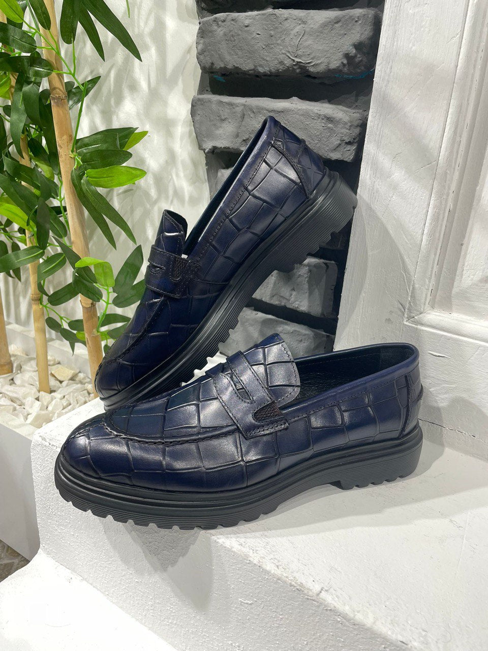 Handmade Navy Blue Crocodile-Embossed Leather Penny Loafers – sleek side view of the luxurious crocodile-embossed leather and contemporary chunky sole for a bold and unexpected element.
