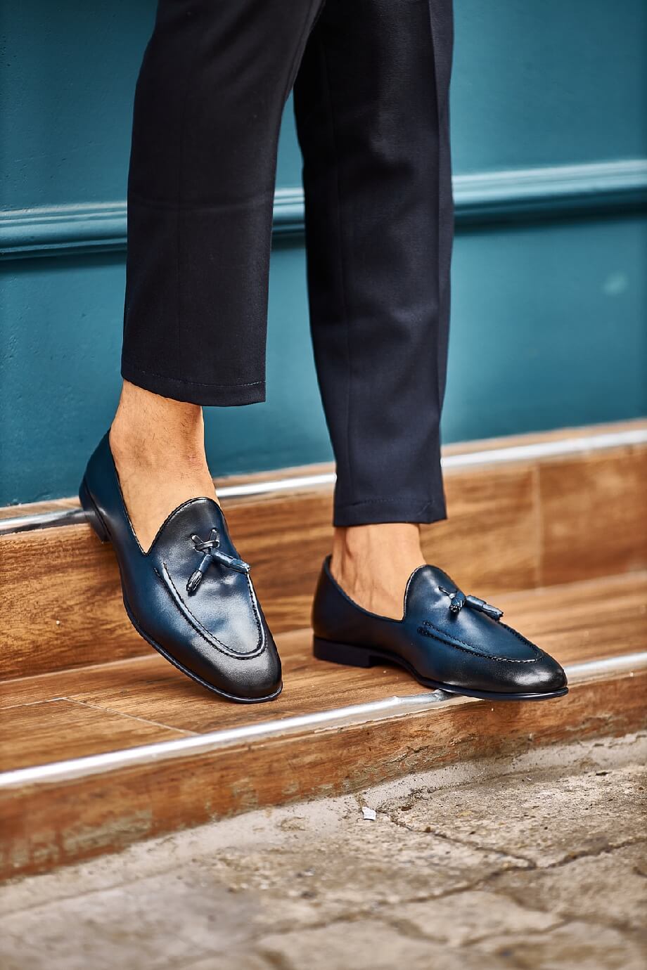 HolloShoe Navy Blue Tassel Loafers - Sophisticated Leather Footwear – worn by a man in black trousers, standing on a wooden step, highlighting timeless style and versatility.