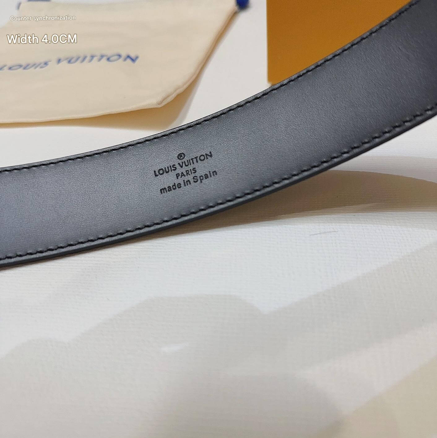 Louis Vuitton belt strap with brand logo on a light background