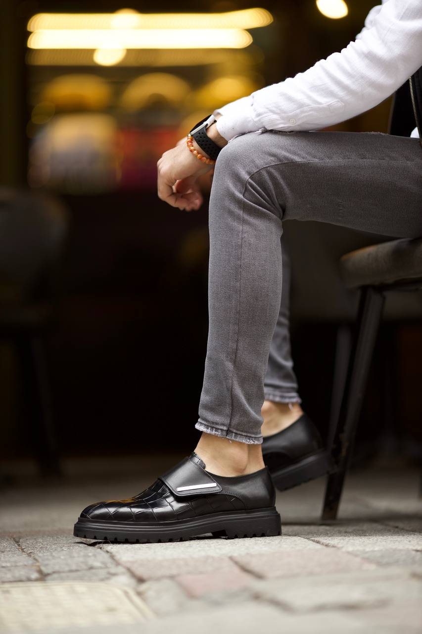 Luxurious Black Crocodile Patterned Leather Shoes – worn by a man in grey jeans, showcasing striking crocodile-embossed texture and comfortable chunky sole.