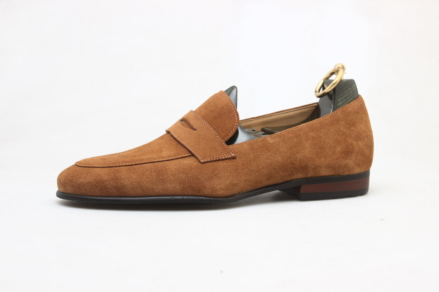Luxurious Sand Suede Penny Loafer – side view with a shoe tree, showcasing premium sand-colored suede and iconic penny loafer design.