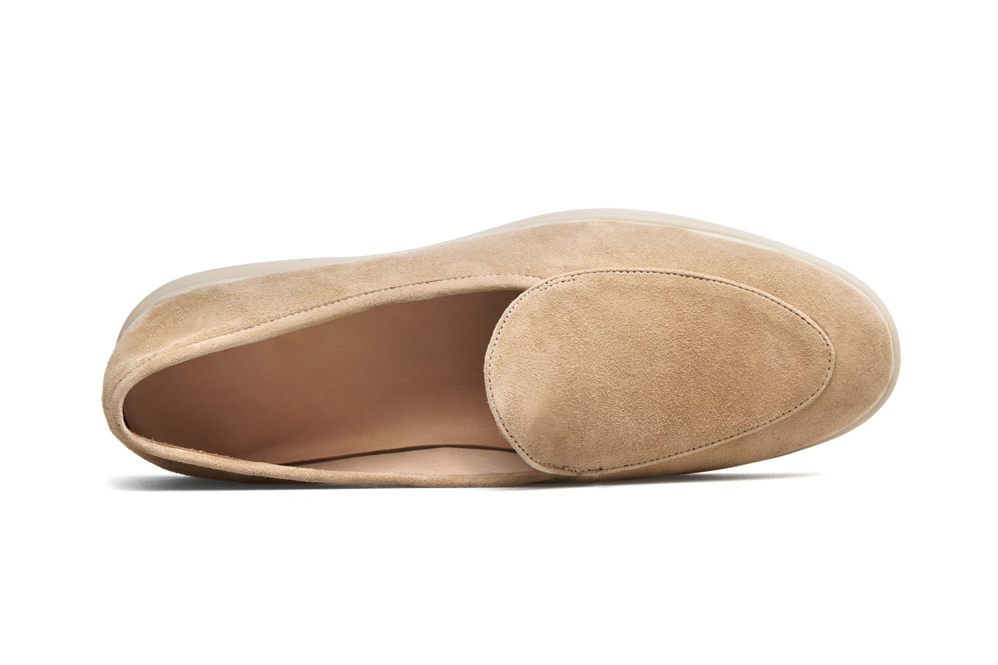Desert-sand suede slip-on loafer on white background, close vamp detail