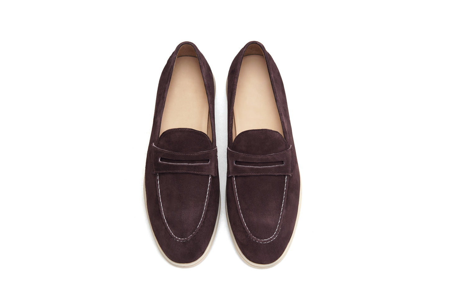 Pair of espresso-brown suede penny loafers on white background, front view