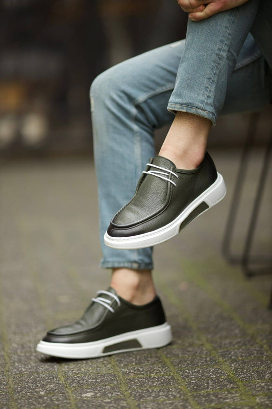 A Green Casual shoe on display.