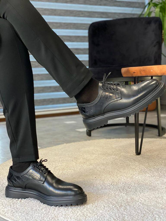 Handcrafted Black Leather Derby Shoes – 100% leather in black, worn by a man in black trousers, displaying seamless blend of classic and modern design.