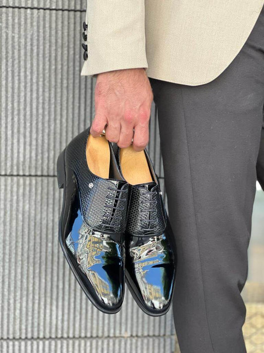 Model showcasing LuxeLace Black Oxfords - premium quality leather dress shoes with a neo-lite sole and a classic lace-up design.