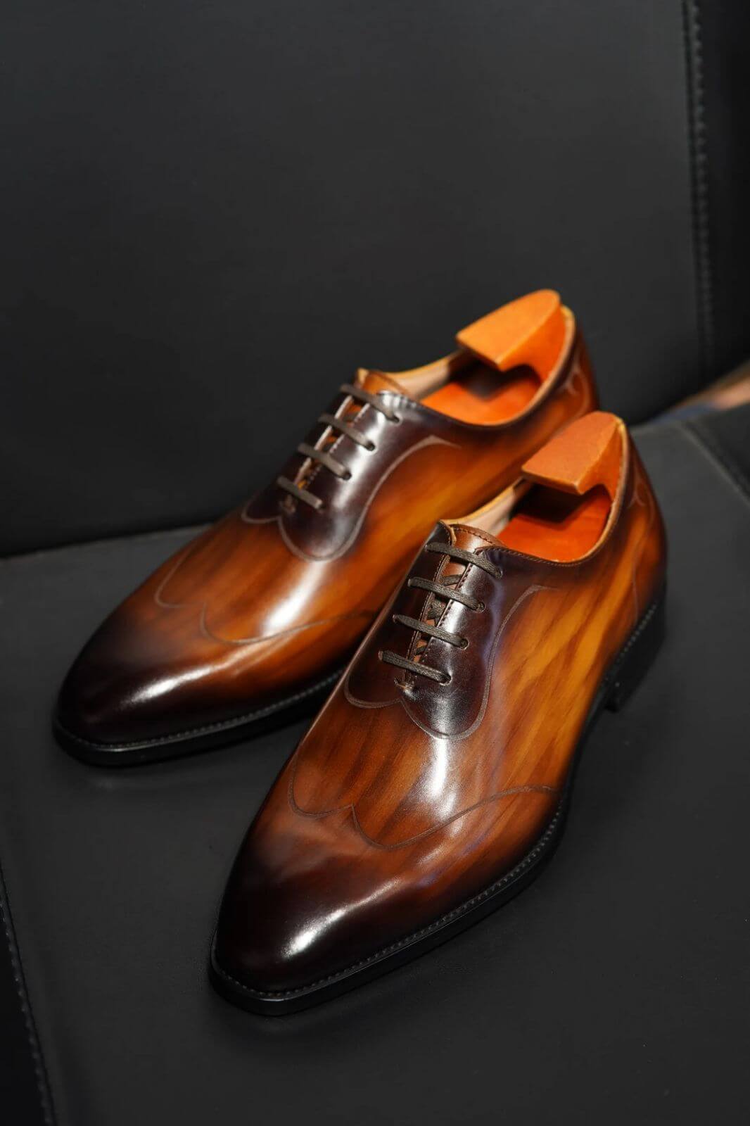 Brown leather oxford shoes on display