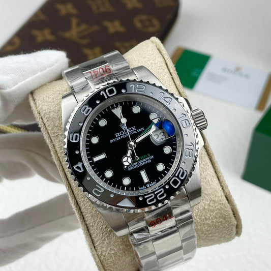 Rolex GMT-Master II "Batman" with a black dial and a Ceramic Bezel.