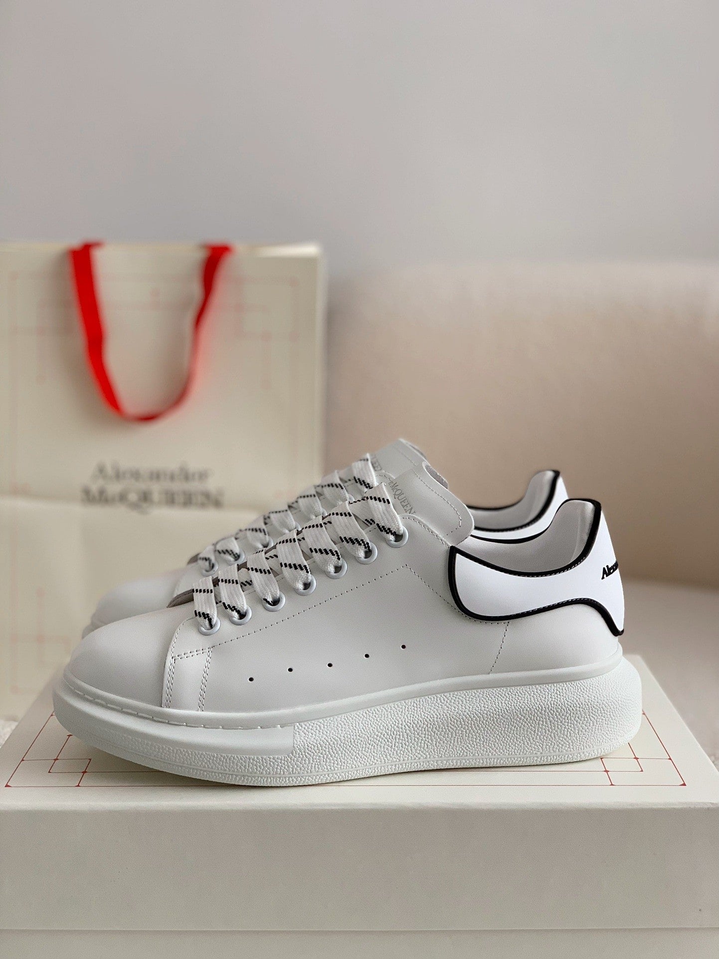 Alexander McQueen Men’s White Leather Oversized Sneakers with Black Piping Detail