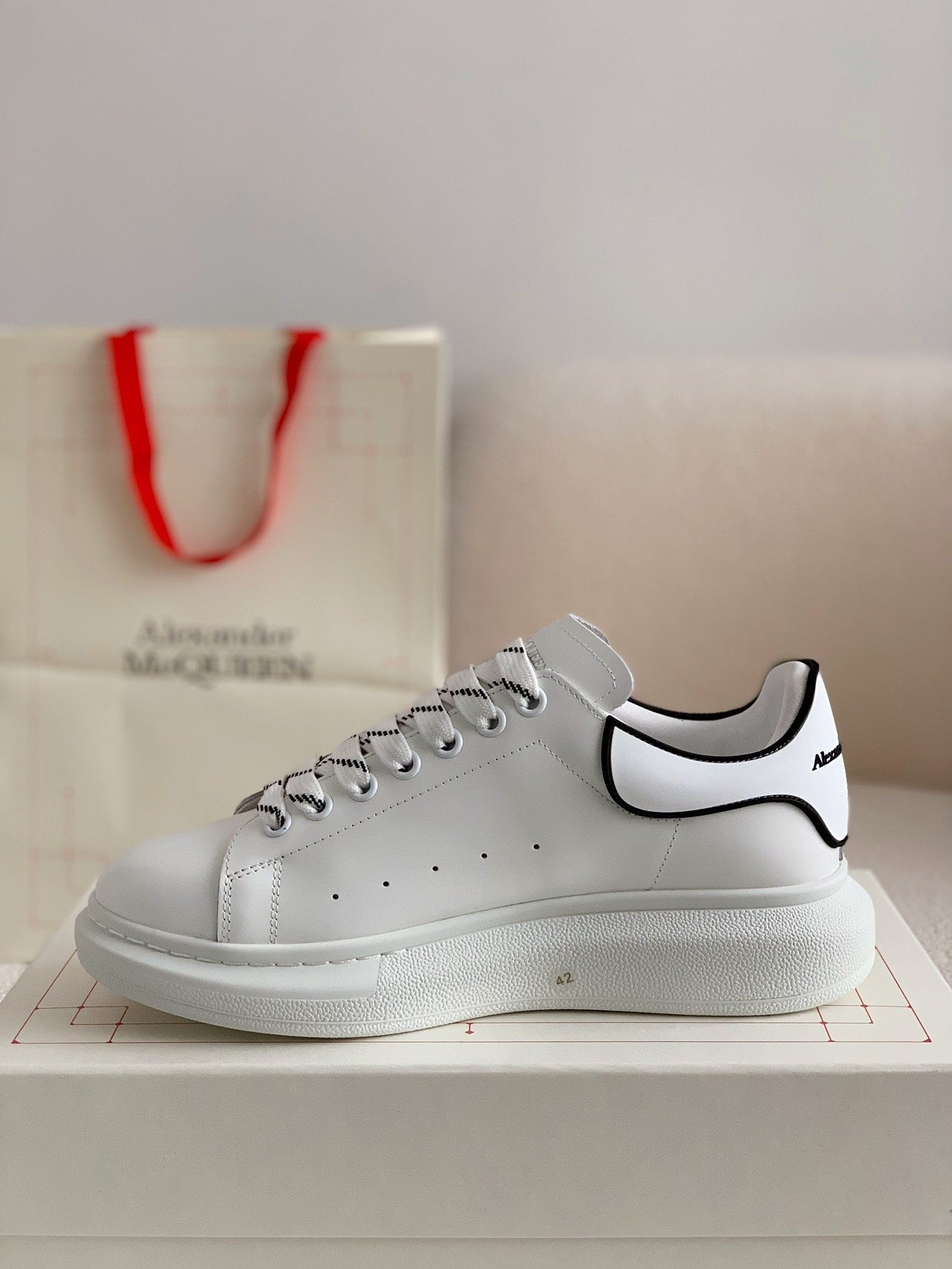 Alexander McQueen Men’s White Leather Oversized Sneakers with Black Piping Detail