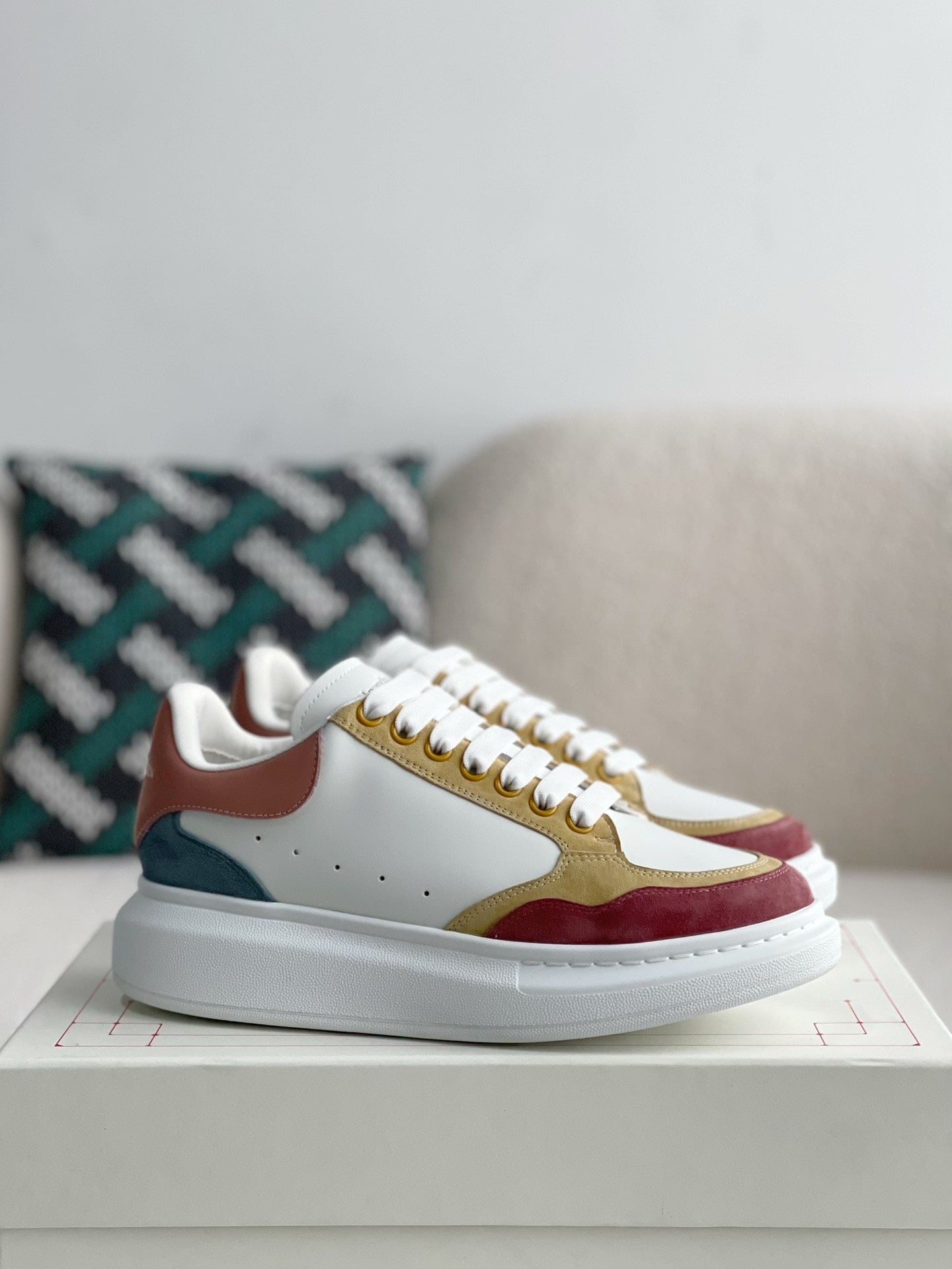 Colorful sneakers on a light surface with a neutral background