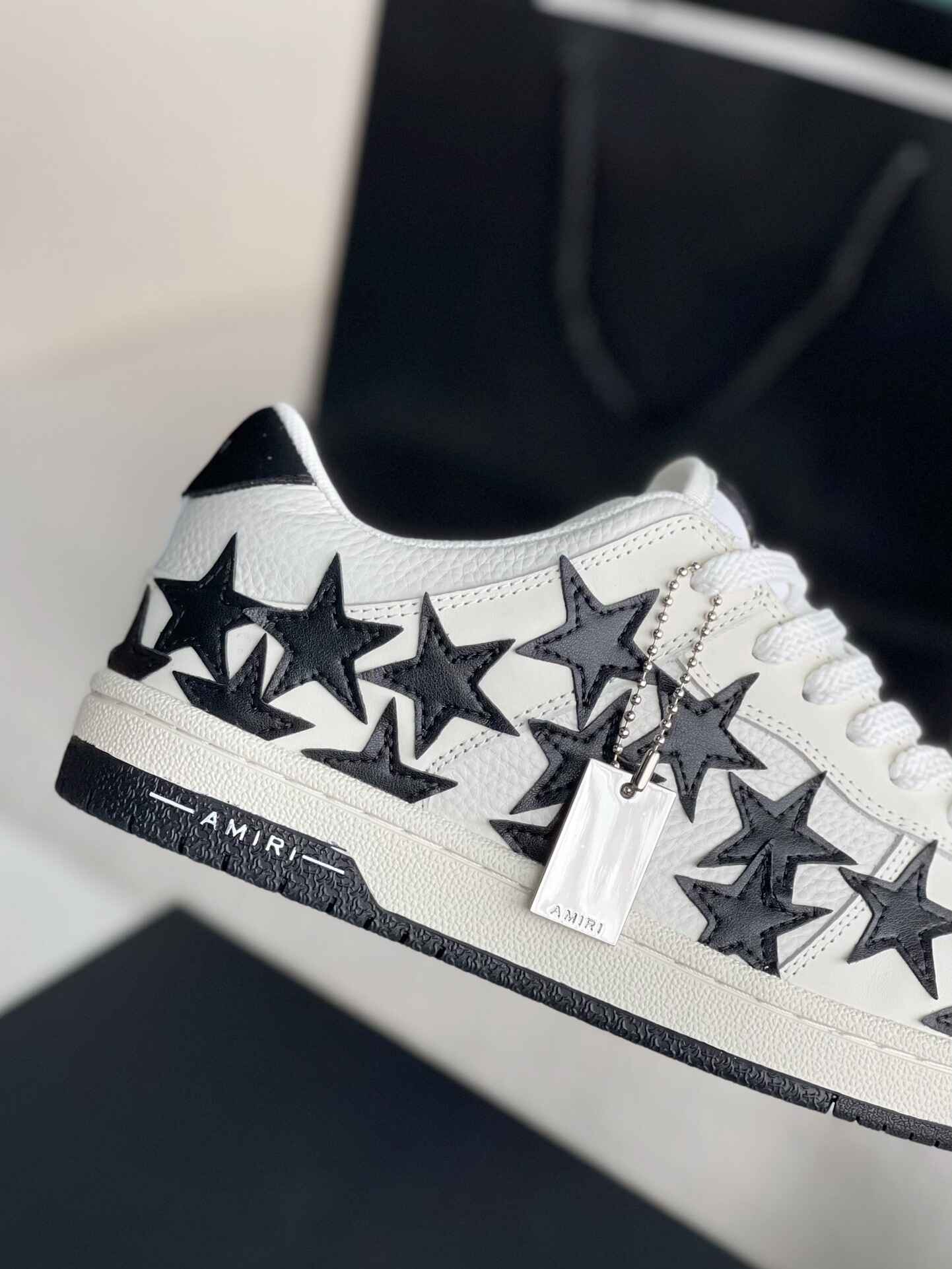 Amiri Star Burst Low – White Grained Leather & Black Stars