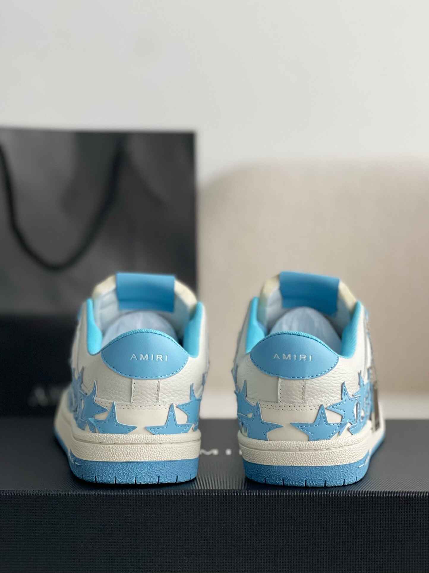 Amiri Star Burst Low – White Grained Leather & Sky Blue Stars