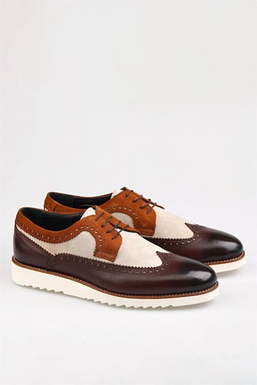 Stylish brown and beige brogue shoes with white rubber soles, featuring a modern design and detailed stitching.