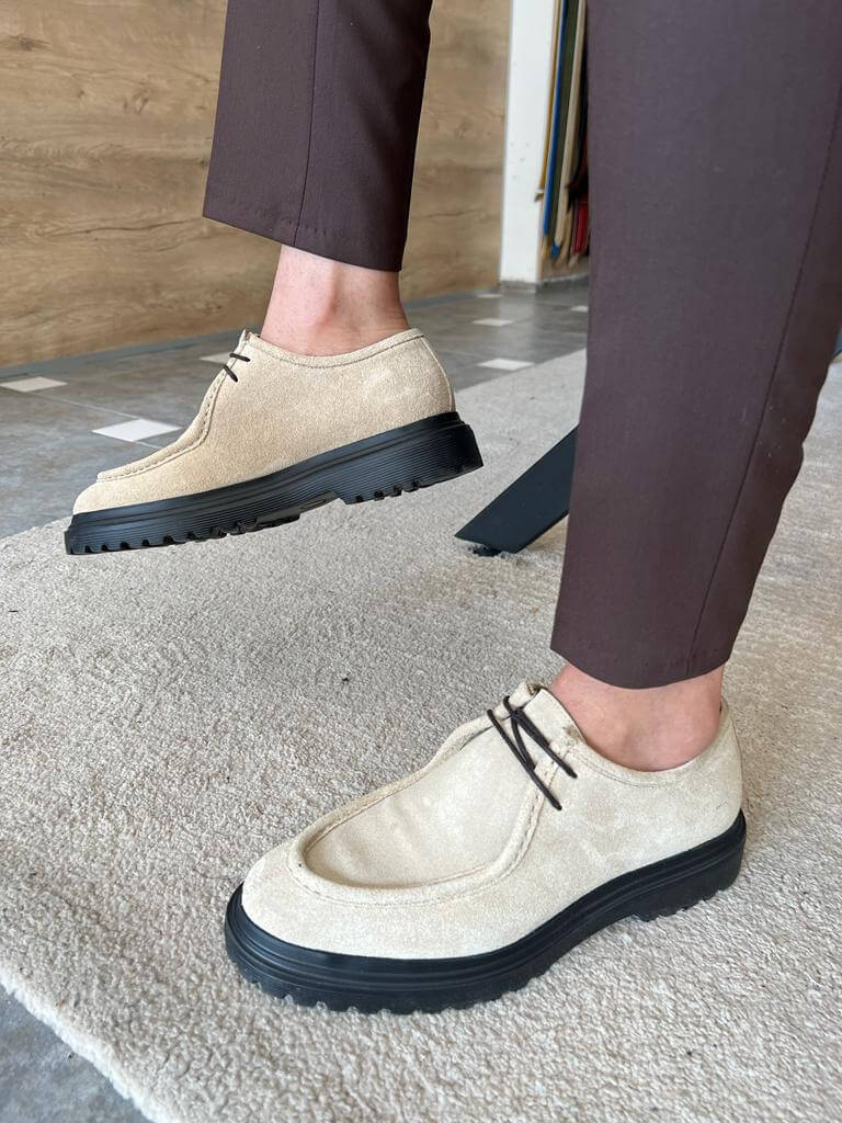 Beige Suede Lace-Up Shoes with Thick Soles – worn by a man in brown trousers, showcasing bold style and comfort on a rug.