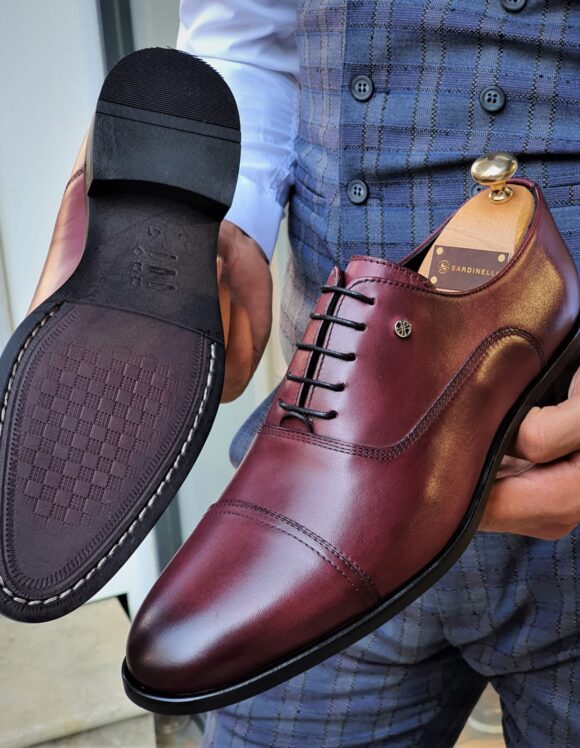 Bordeaux Crest Luxe Cap-Toe Oxfords in burgundy leather, showing sole and cap-toe detail.
