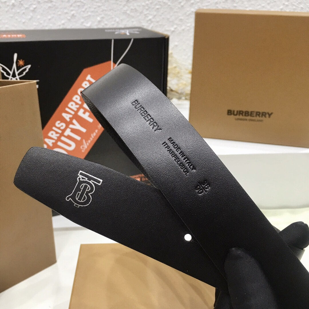 Black Burberry belt with branded box in the background