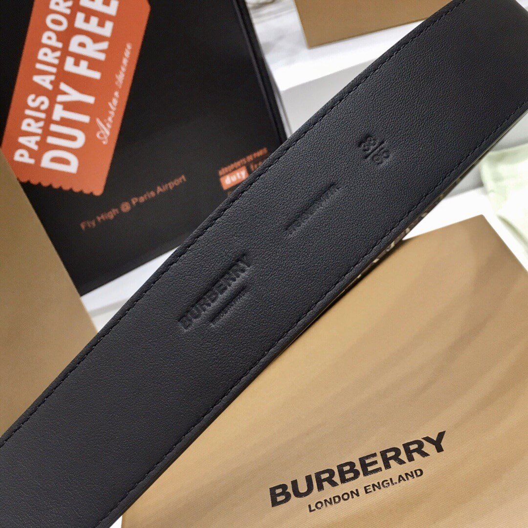 Black Burberry belt with a visible logo on a Burberry branded box.