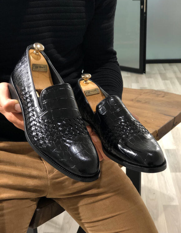 Classic Black Calf Leather Loafers for Formal & Semi-Formal Wear – pair held by a man's hands, highlighting a sleek and sophisticated black finish, perfect for any formal occasion.