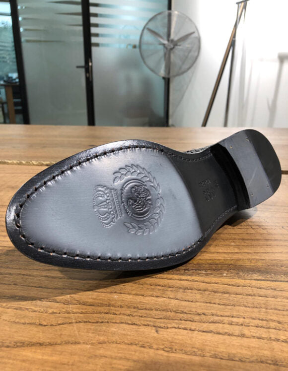 Classic Black Calf Leather Loafer for Formal & Semi-Formal Wear – underside view, showing durable leather sole with elegant branded embossing.