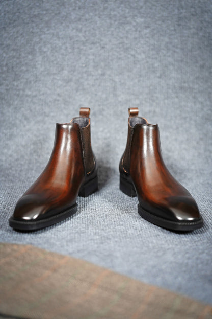 Classic Brown Leather Chelsea Boots for Everyday Versatility – a top-down view of the brown leather boots on a gray background, showcasing the pointed toe.