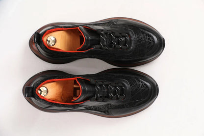 Custer Black Mid-top Leather Sneakers – top-down view, showcasing premium genuine black leather with a subtle pattern and a bold red-accented sole.