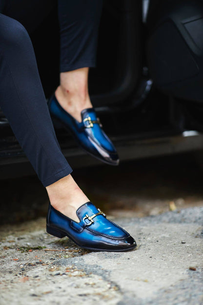 Custer Blue Bit Loafers – Classic Leather Footwear for Every Occasion – worn by a man in dark trousers, stepping out of a car, showcasing a polished finish and a classic horsebit buckle.