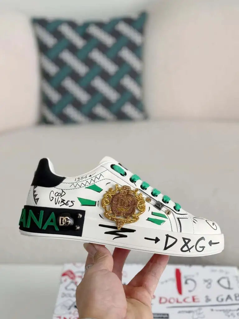 Dolce & Gabbana Portofino Sneaker – White Graffiti, Green Accents & Gold Crest