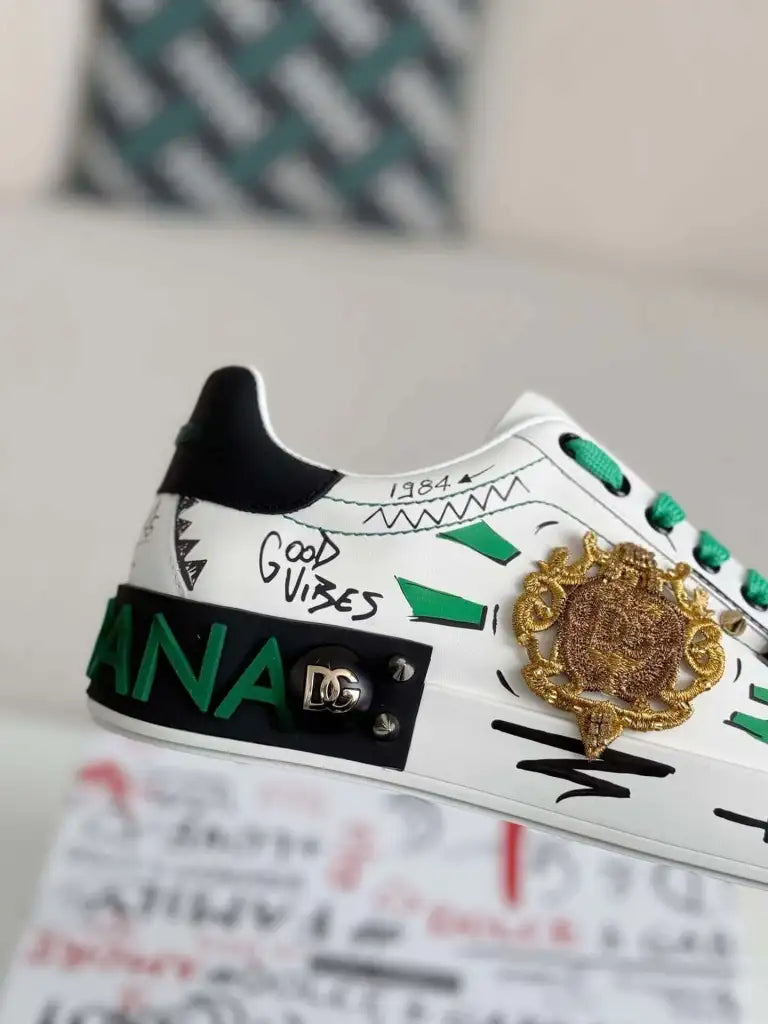 Dolce & Gabbana Portofino Sneaker – White Graffiti, Green Accents & Gold Crest