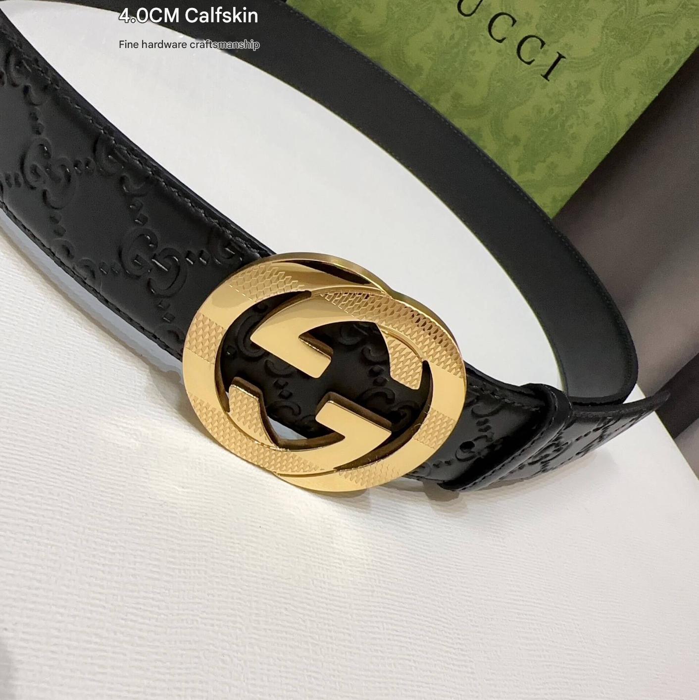 Black Gucci belt with gold interlocking G buckle on a white background