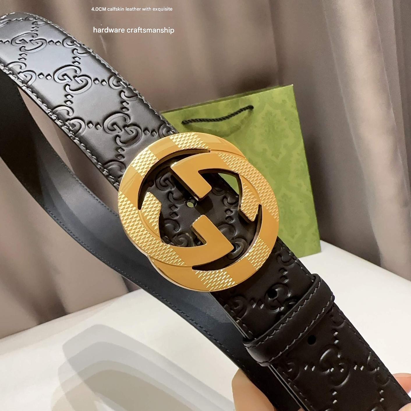 Black leather belt with gold interlocking G buckle on a neutral background