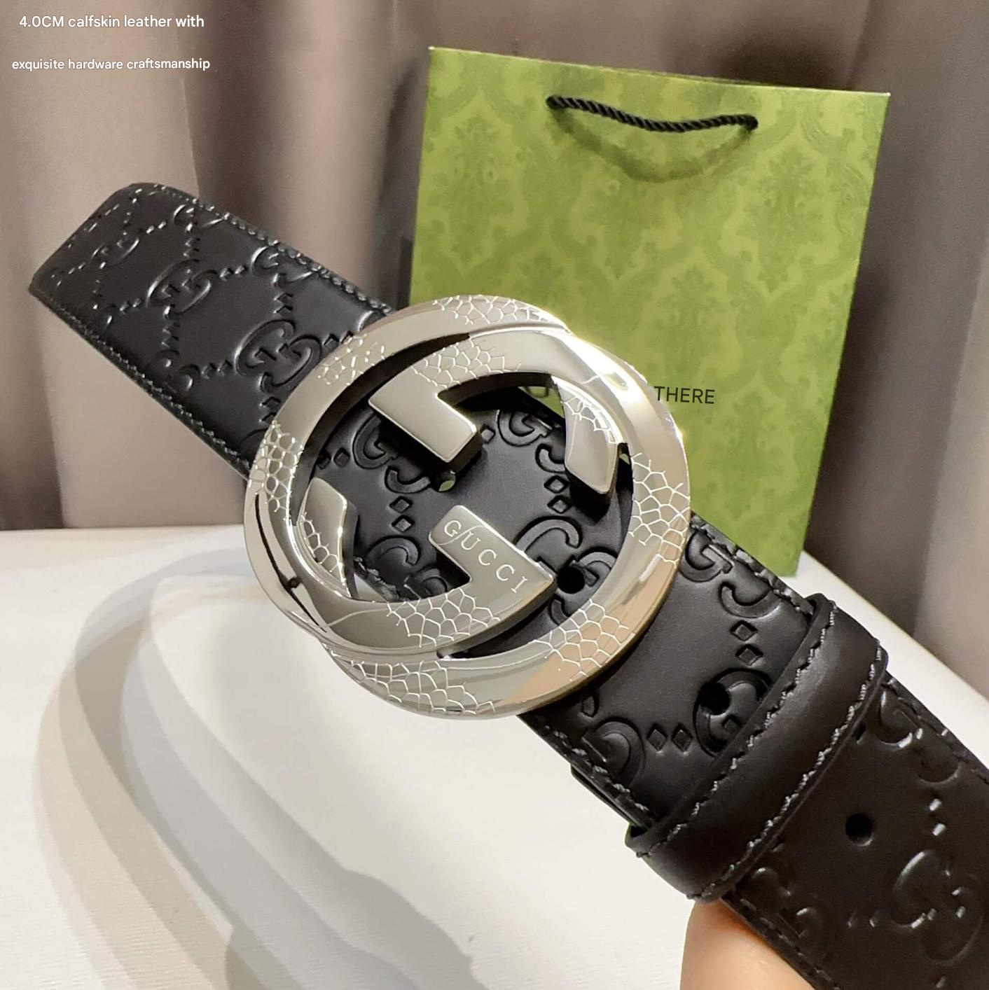 Black Gucci belt with silver interlocking G buckle on a neutral background