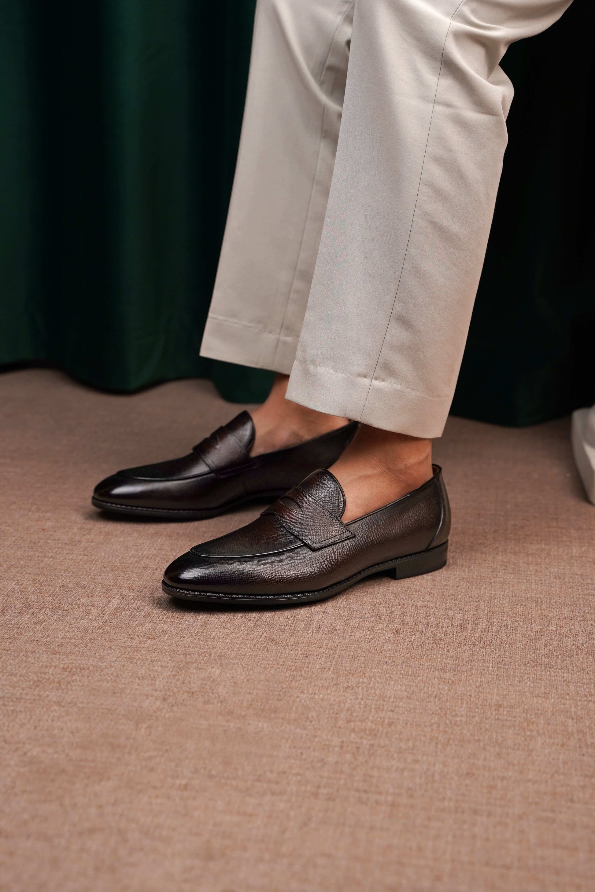 Hand-Finished Espresso Brown Leather Penny Loafers – worn by a man in light trousers, showcasing elegant everyday wear and sophisticated urban style.