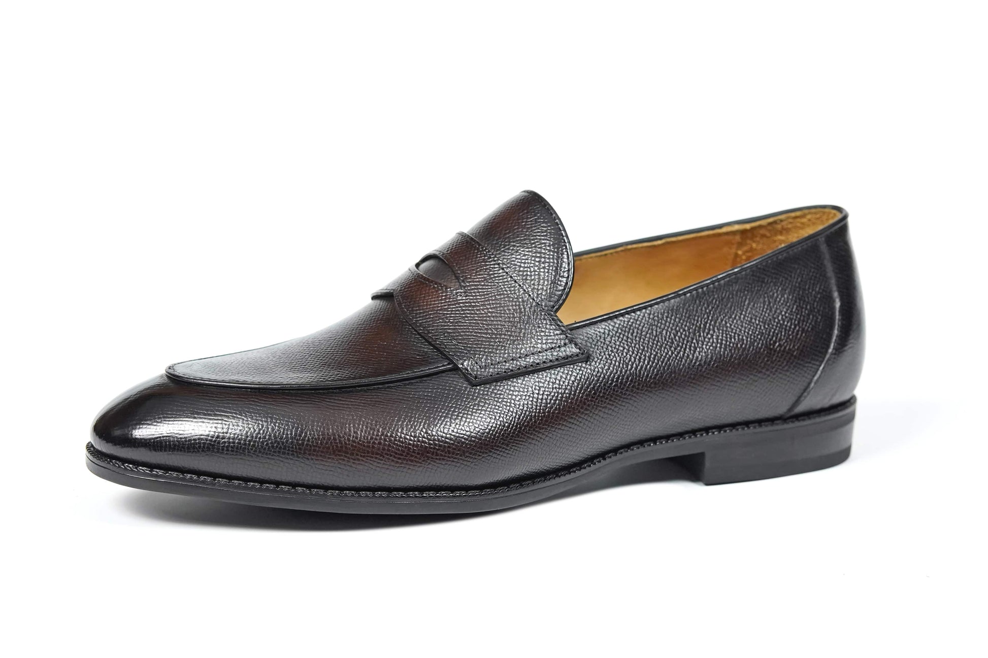Hand-Finished Espresso Brown Leather Penny Loafer – side-lying view, showcasing the fine pebble texture of the full-grain leather and custom rubber sole.