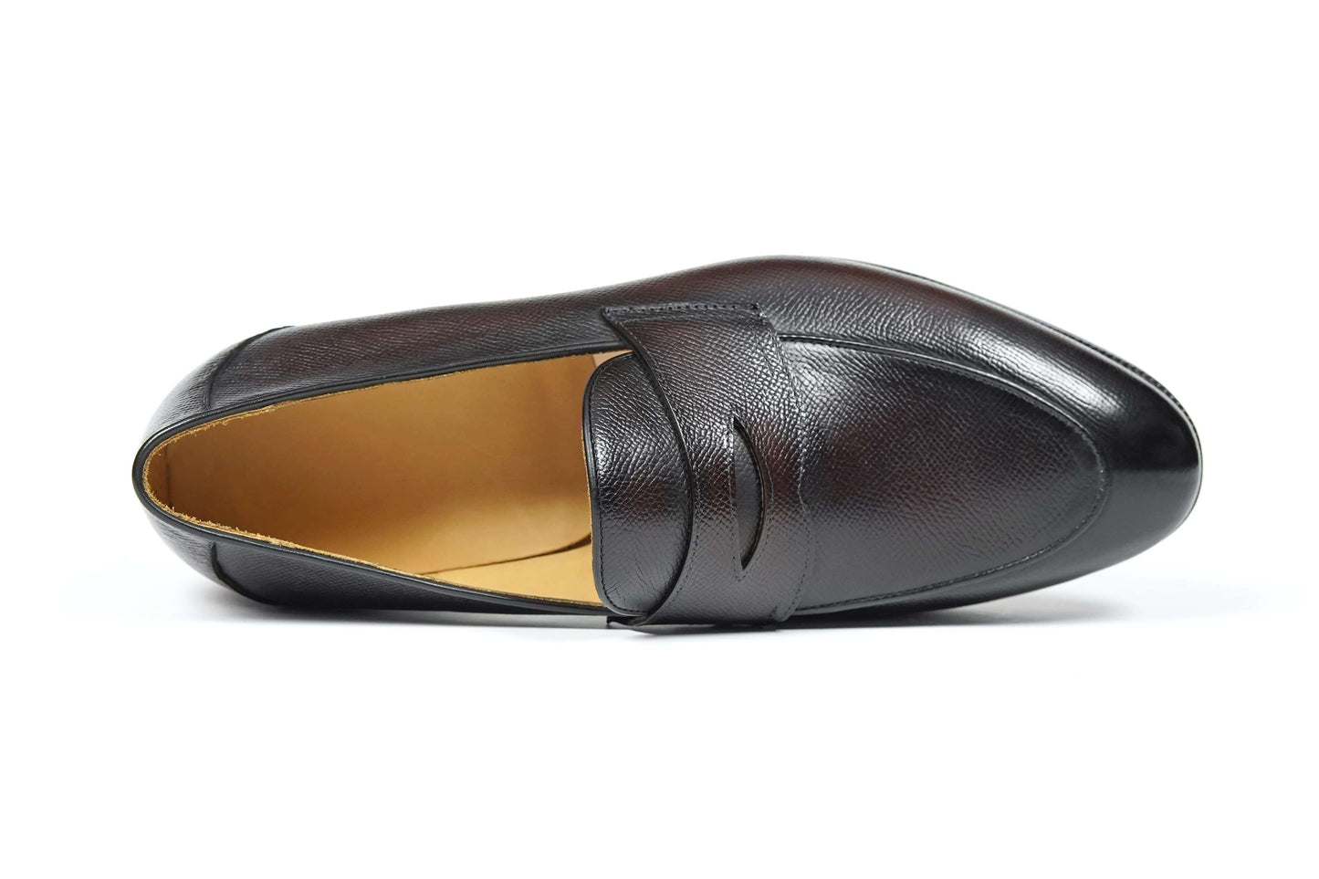 Hand-Finished Espresso Brown Leather Penny Loafer – side-lying view, showcasing the fine pebble texture of the full-grain leather and custom rubber sole.