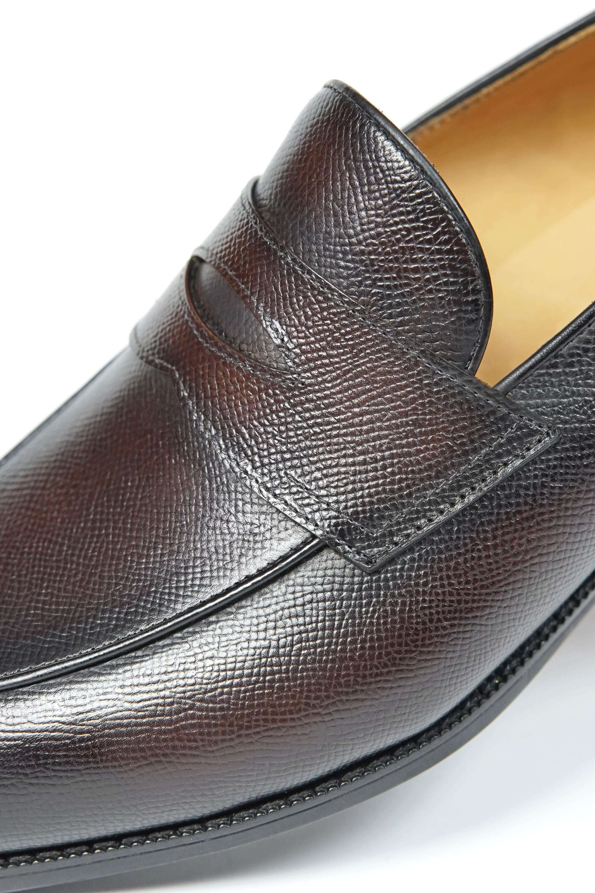 Hand-Finished Espresso Brown Leather Penny Loafers – close-up of premium textured full-grain leather upper with hand-finished sheen and minimalist penny strap detail.