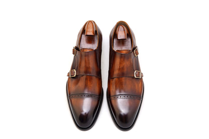 Hand-Polished Brown Double Monk Strap Shoes – pair with shoe trees, top-down view, highlighting rich hand-polished leather and classic double buckle design.