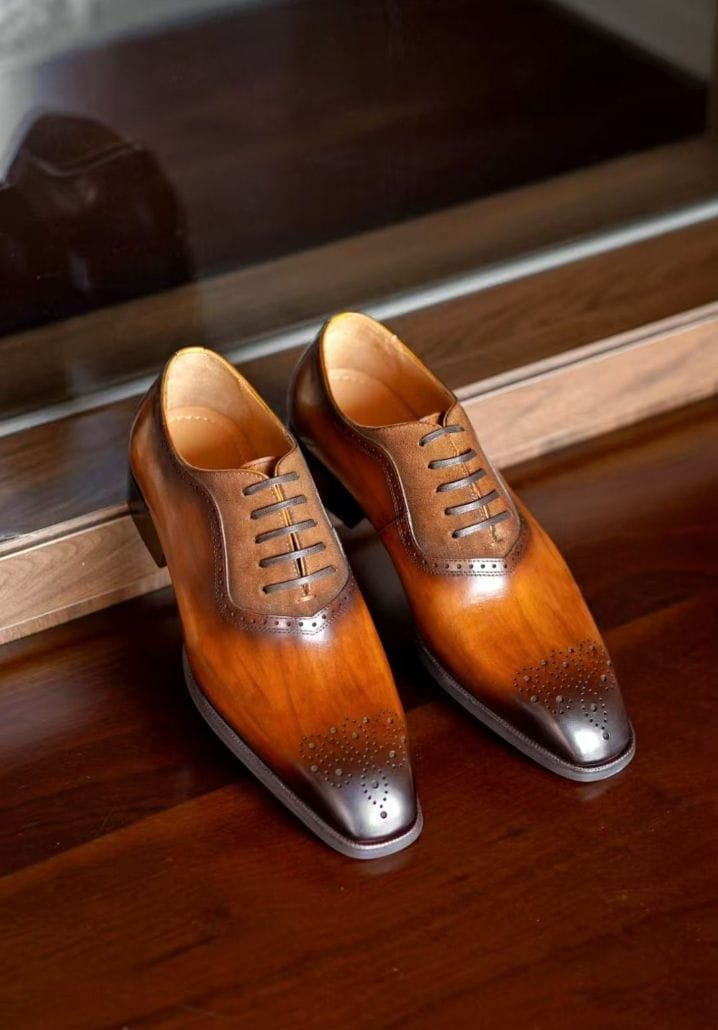 Burnished brown brogue Oxford with suede throat detail and chiseled toe, side view