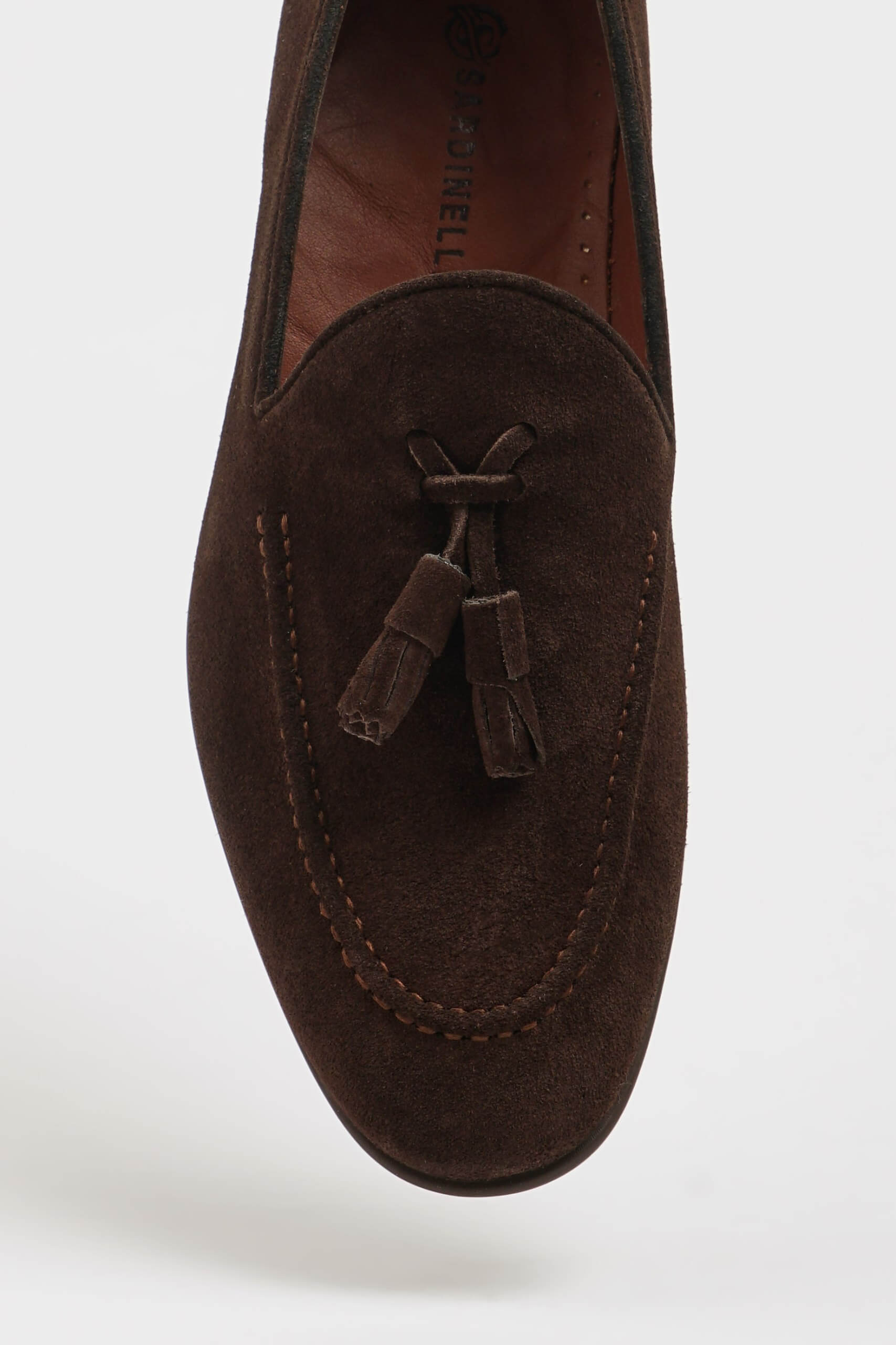 Handcrafted Brown Suede Tassel Loafer for Men – close-up top-down view, showcasing the soft brown suede texture and sophisticated tassel detail.