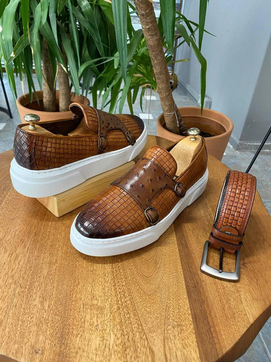 Handcrafted Camel Double Buckle Leather Sneakers – pair with shoe trees and double buckles, highlighting the woven-like design and thick white Eva sole, next to a matching belt.