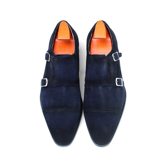 Handcrafted Navy Suede Double Monk Strap Dress Shoes – top-down view of pair with shoe trees, emphasizing luxurious suede and sleek buckle closures.