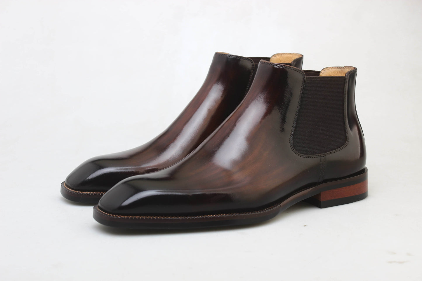 Handcrafted Polished Brown Leather Chelsea Boots for Sophisticated Style – a front-facing shot of the pair of polished brown Chelsea boots on a white background.
