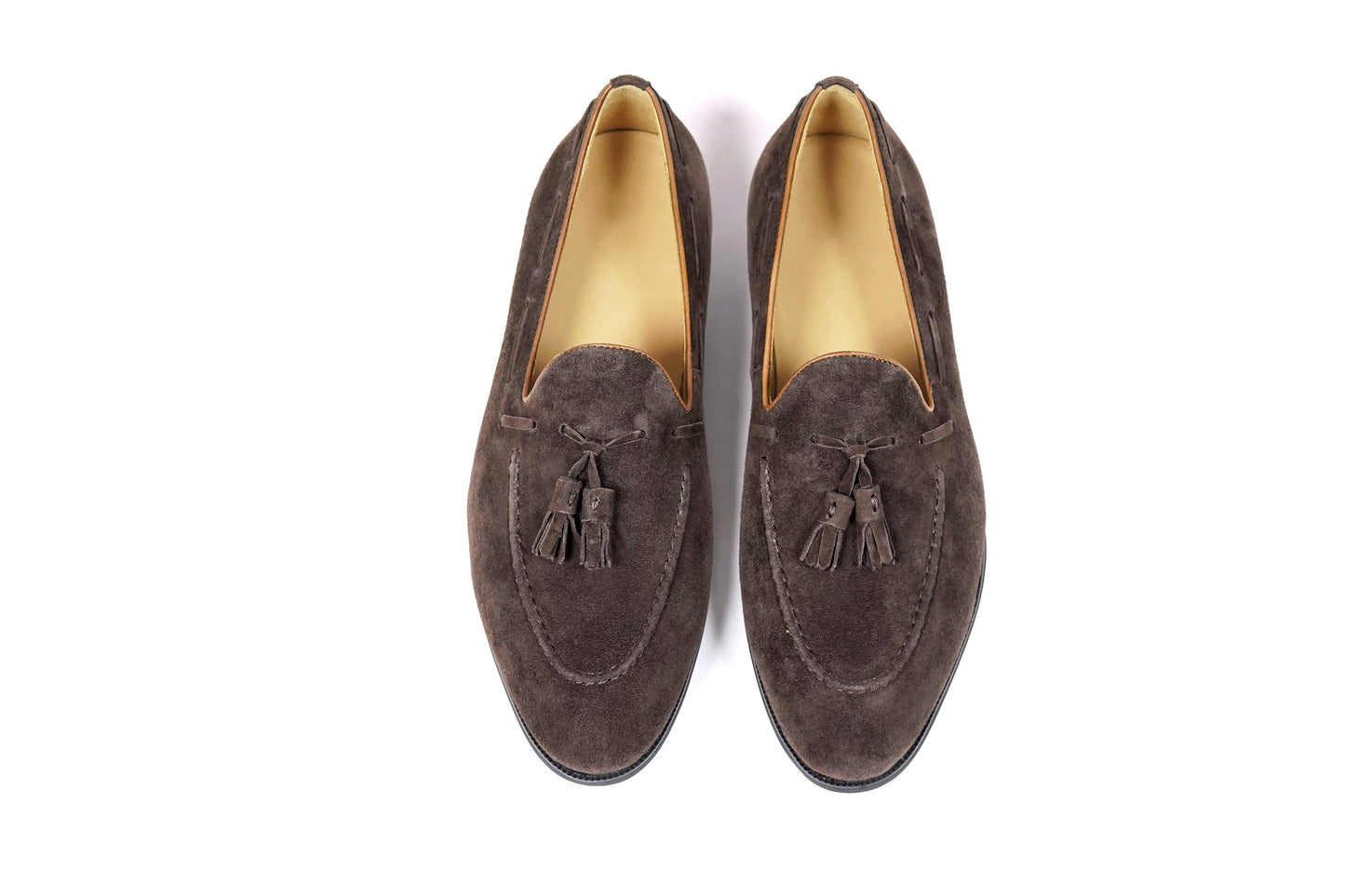 Handcrafted Umber Dark Brown Tassel Suede Loafer – close-up of classic tassels and dark brown suede texture, emphasizing timeless refinement.