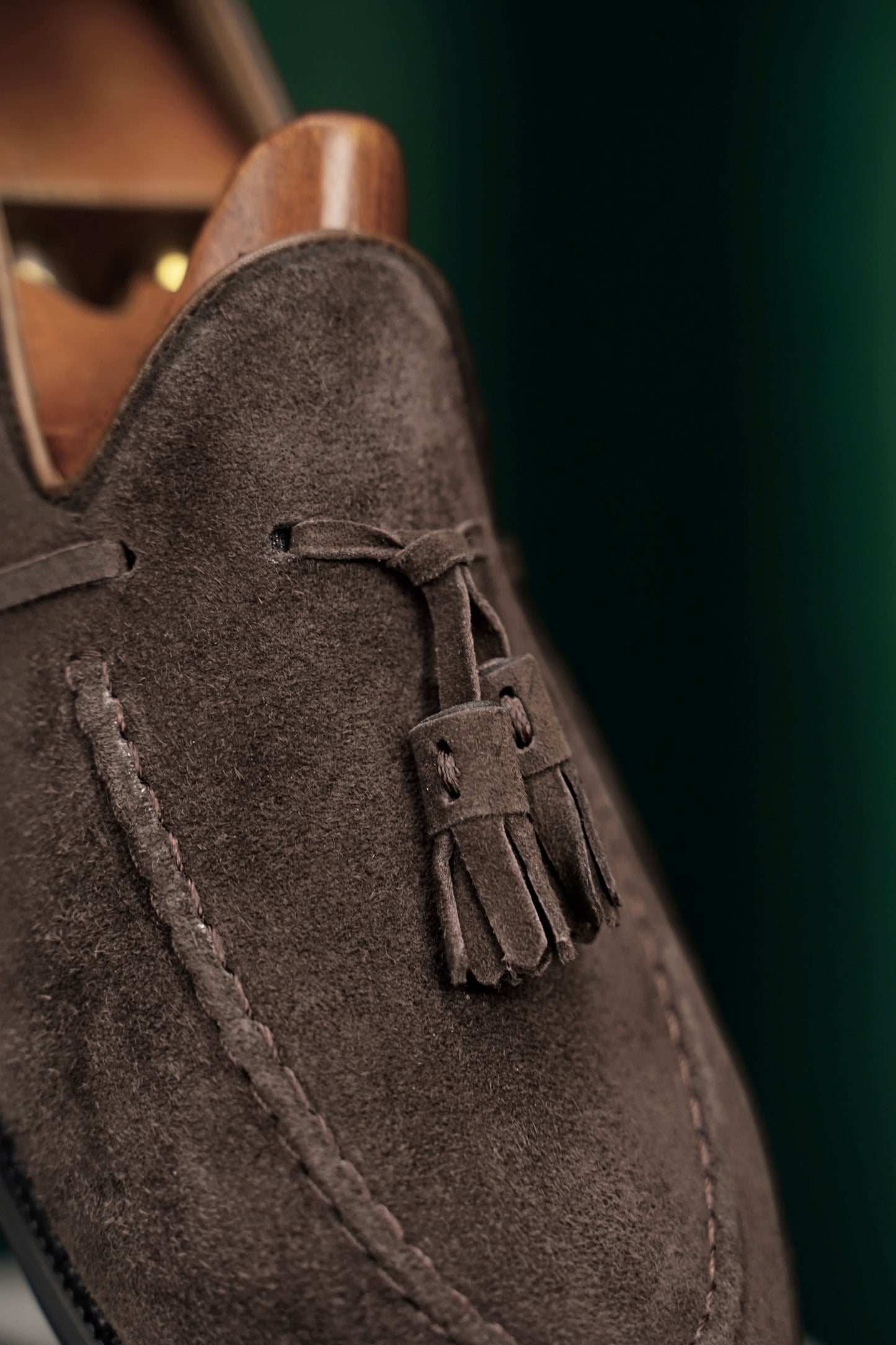 Handcrafted Umber Dark Brown Tassel Suede Loafer – close-up of the tassel, emphasizing hand-cut details and soft dark brown suede texture.